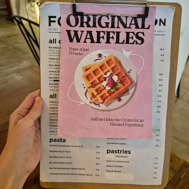 The printed clipboard menu on the cafe counter, as transcribed above