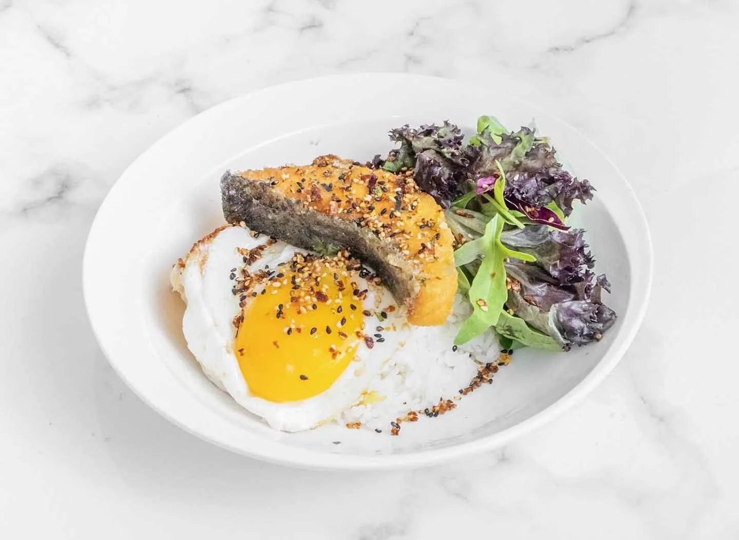 Salmon deopbap: torched salmon over rice with a sunny-side egg