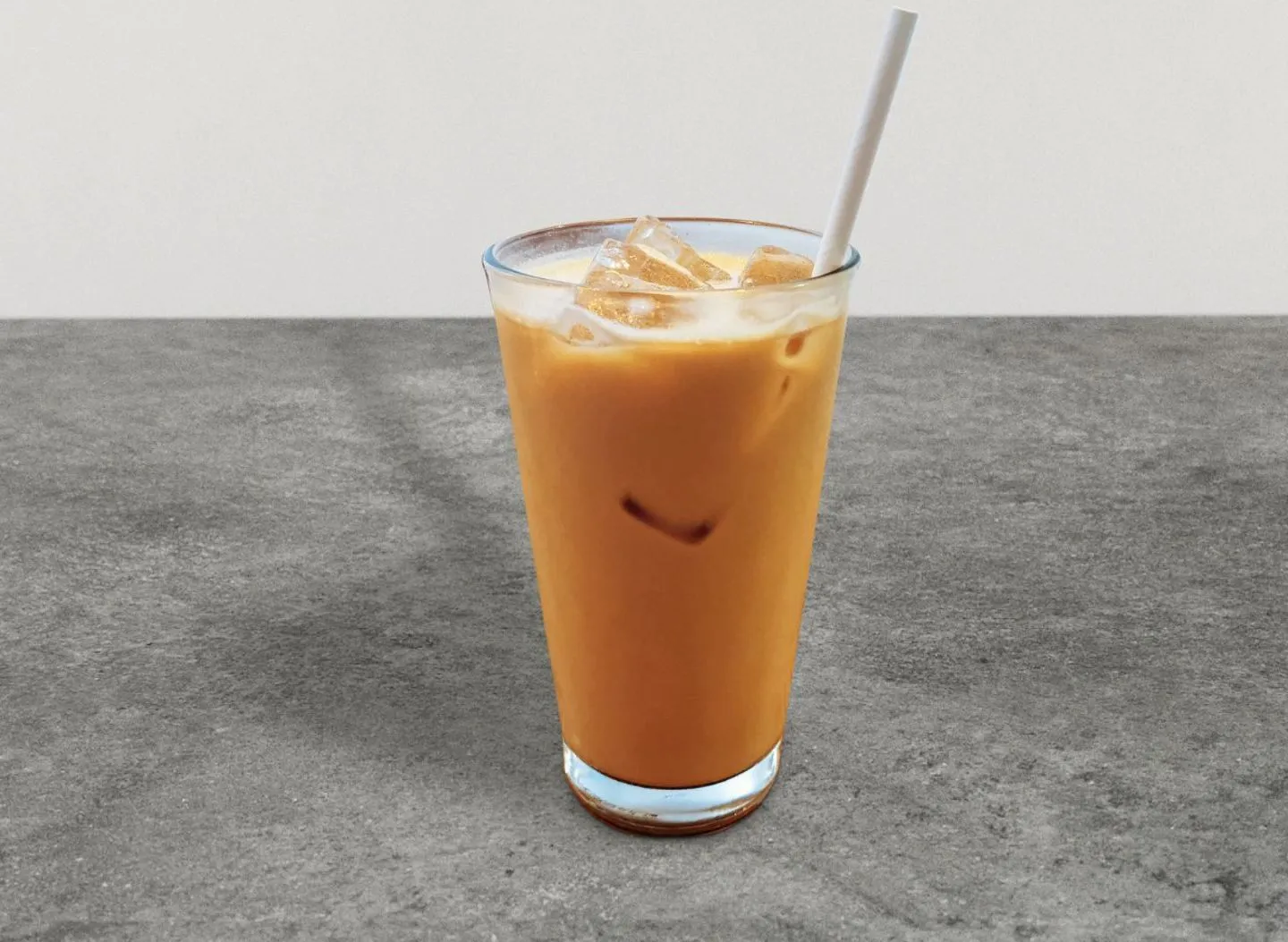 An iced sea-salt caramel latte in a tall glass